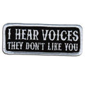 I Hear Voices Patch 4 Inch: Description
I Hear Voices, They Don't Like You" embroidered in white on a black background with w