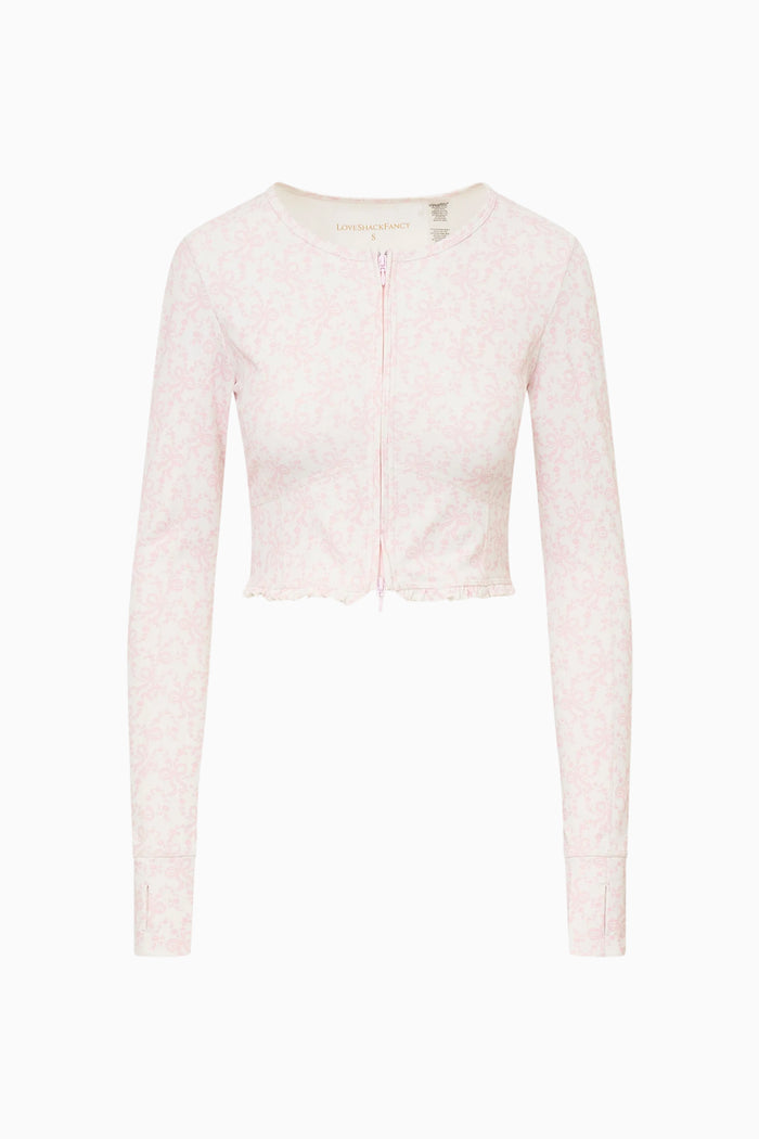 Light pink textured cardigan on a white background