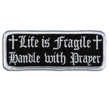 Life Is Fragile Patch 4 Inch: Description
"Life is Fragile, Handle With Prayer" embroidered in fancy white lettering and cros