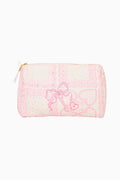 Small pouch with pink heart pattern on a white background
