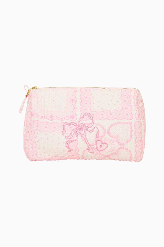 Small pouch with pink heart pattern on a white background
