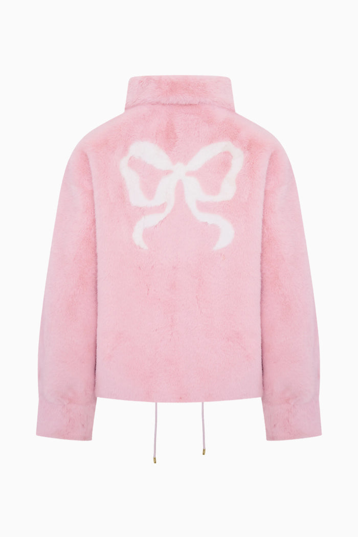 Pink jacket with a large white bow design on a white background